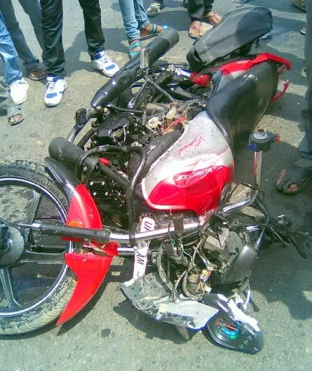 Three people aboard bike collided with truck collision