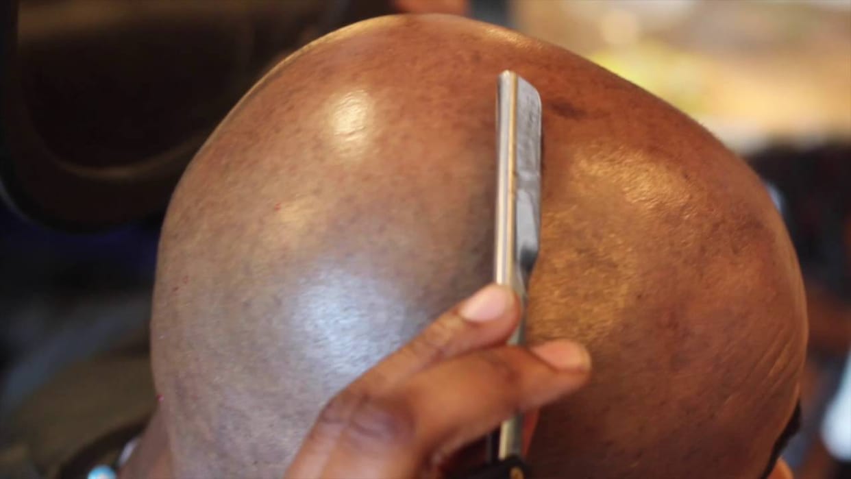 Cut the hair of two young men in Rajasthan