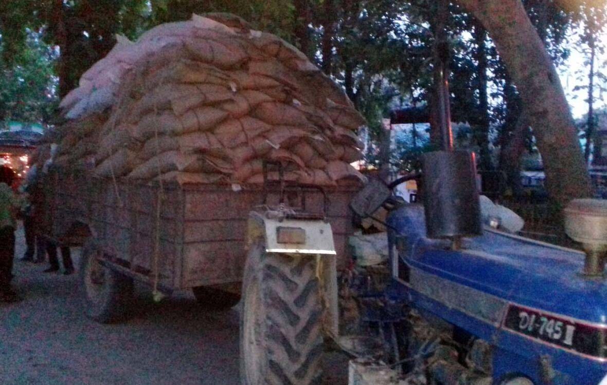 Government grain laden tractor trolley caught