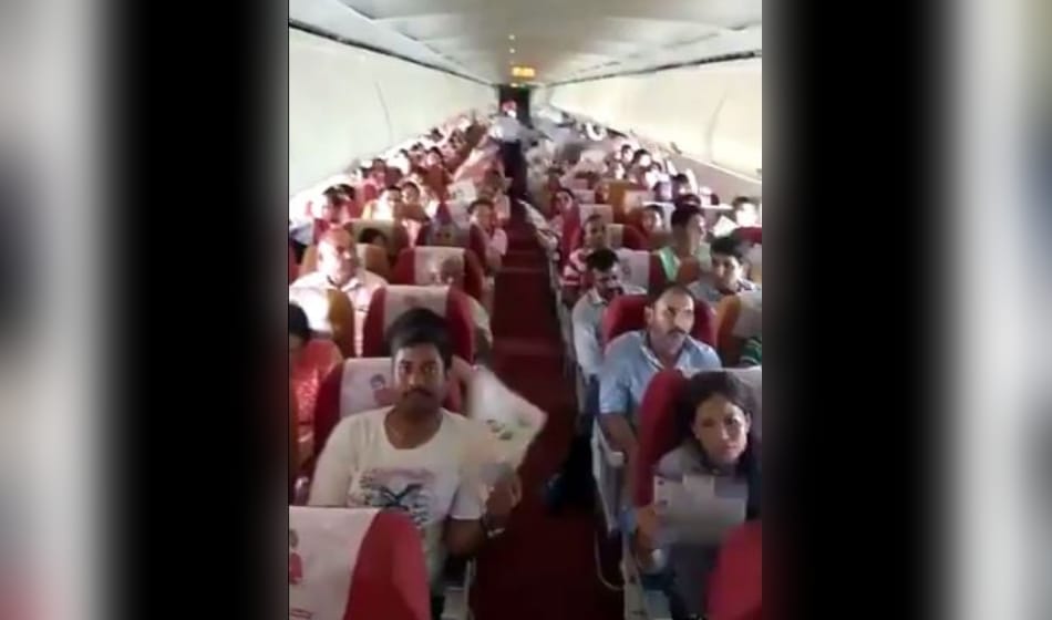 after ac malfunction on air india flight from bagdogra to delhi passengers use paper fan for relief