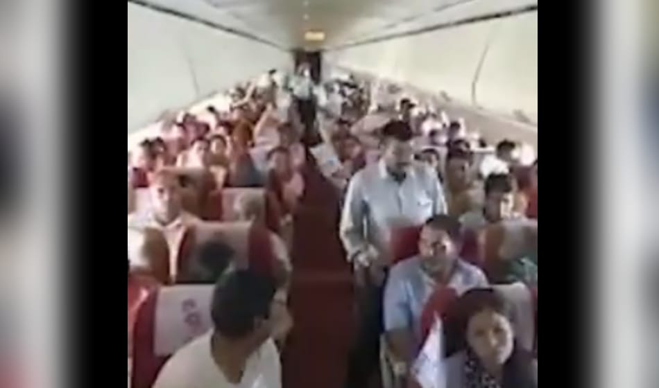 after ac malfunction on air india flight from bagdogra to delhi passengers use paper fan for relief