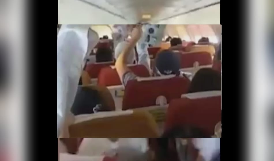after ac malfunction on air india flight from bagdogra to delhi passengers use paper fan for relief