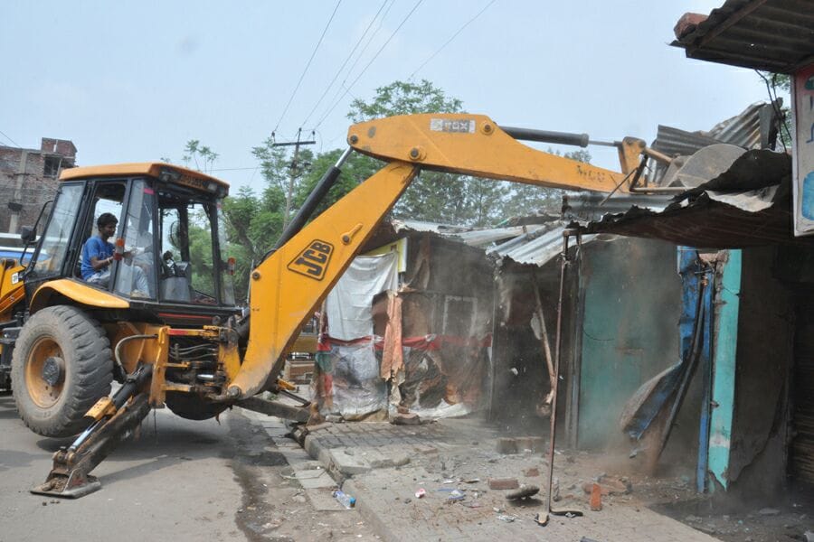 corporation runs JCB on 25 Houses in Indira colony