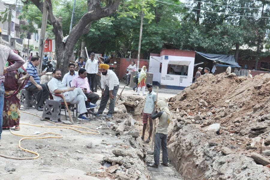 corporation runs JCB on 25 Houses in Indira colony