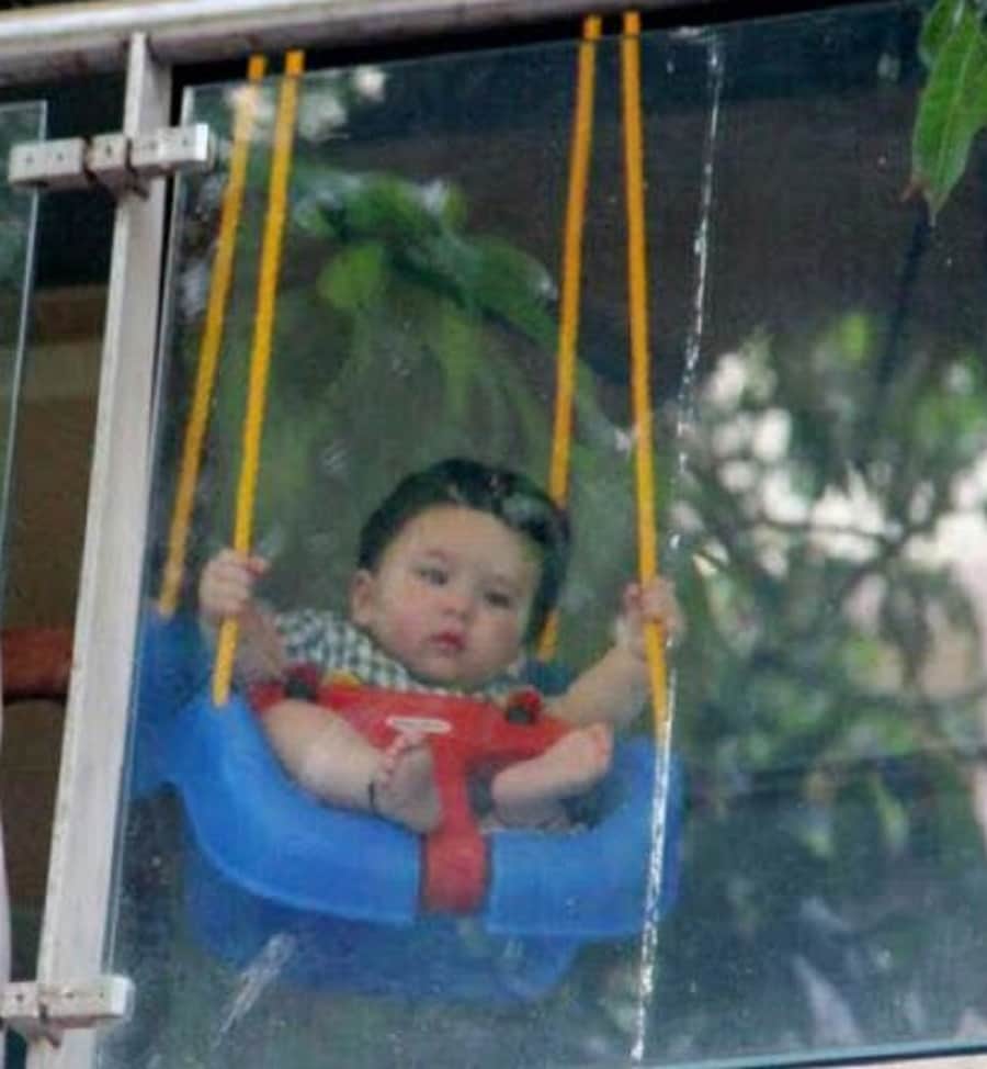saif ali khan and kareena kapoor khan son taimur  enjoying on the swing