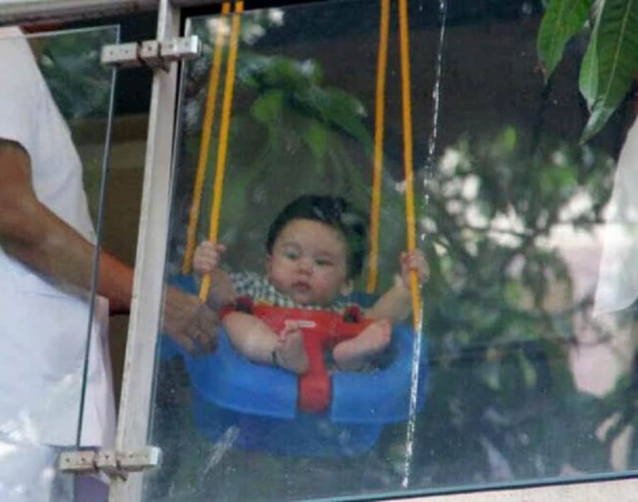 saif ali khan and kareena kapoor khan son taimur  enjoying on the swing