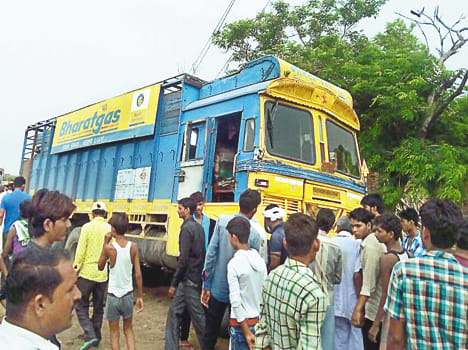 The cylinder laden truck strikes the young man