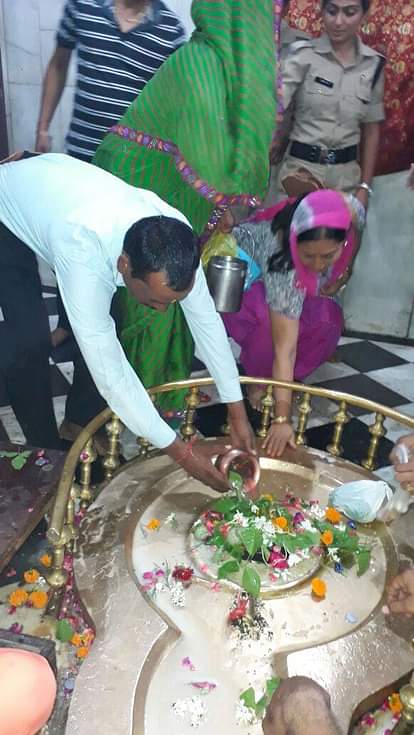devotees offering prayers in shiv temple on first monday of savan in meerut