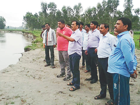 ADM visits flood waters of Pandu river