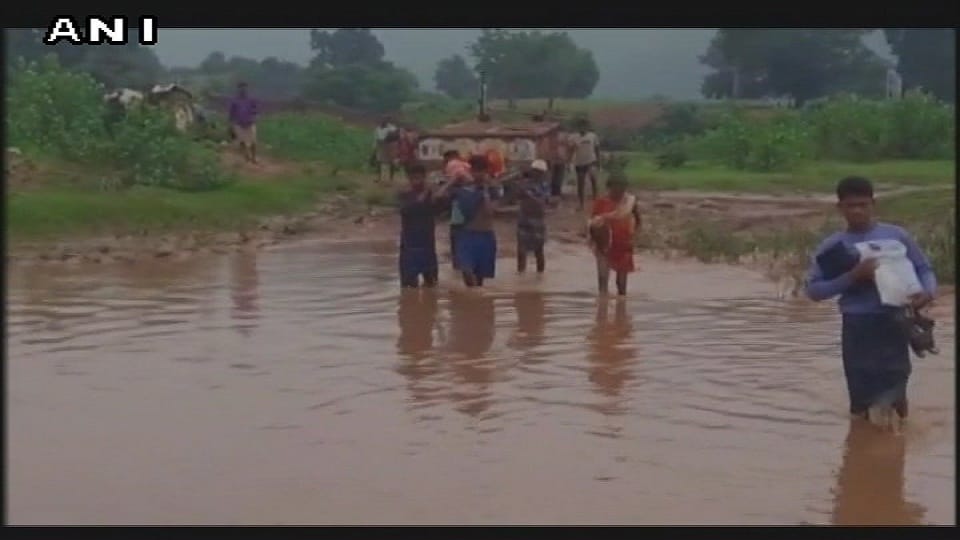 Pregnant woman forced to cross river on a stretcher carried in Rayagada district Odisha