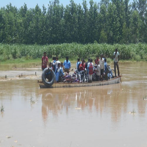 Rain havoc ... here students go to school by boat, view Photos