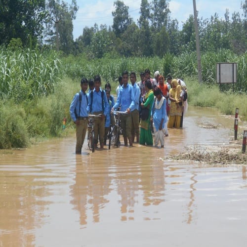 Rain havoc ... here students go to school by boat, view Photos