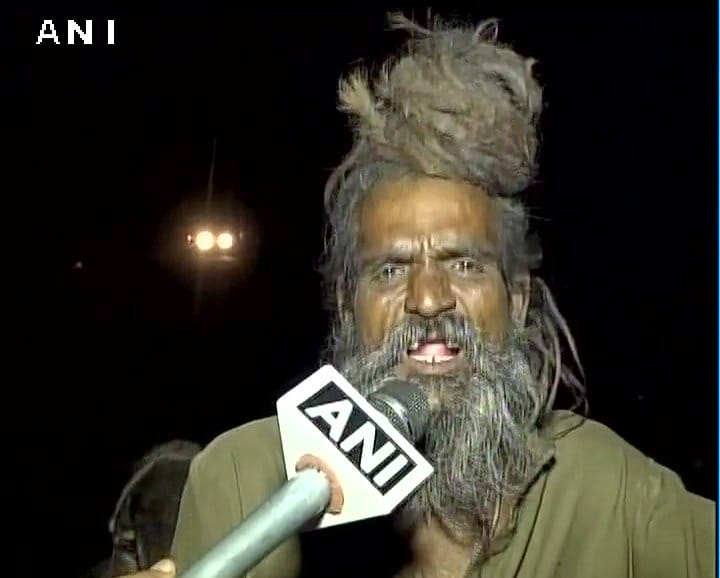 Sadhu Dula Nath along with his dogs travels to religious places on a bike