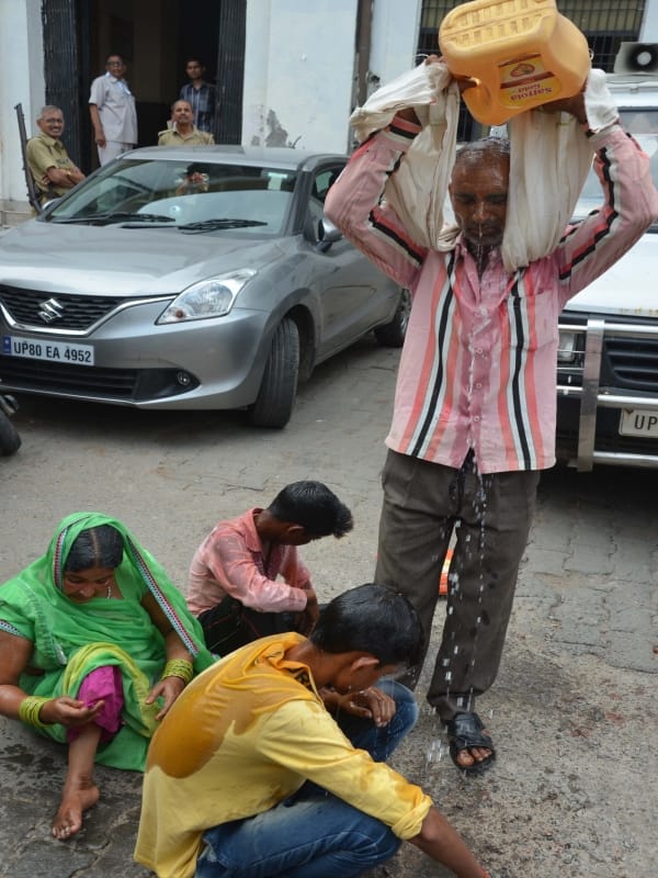 family tried to burn himself in agra collectorate