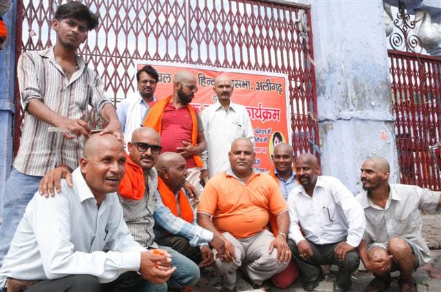 Collective mundan in protest against terror attacks on devotees