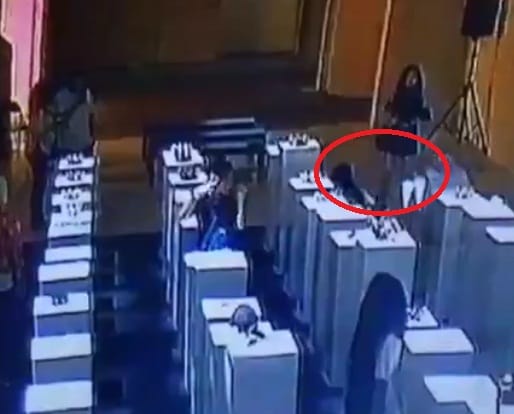 Women breaks art worth crores while taking selfie a 14th factory exhibition in the USA