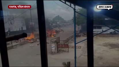 PROTESTORS North Dinajpur Adivasi Samannoy Committee SETS BULIDUINGS AND VEHICLES ABLAZE
