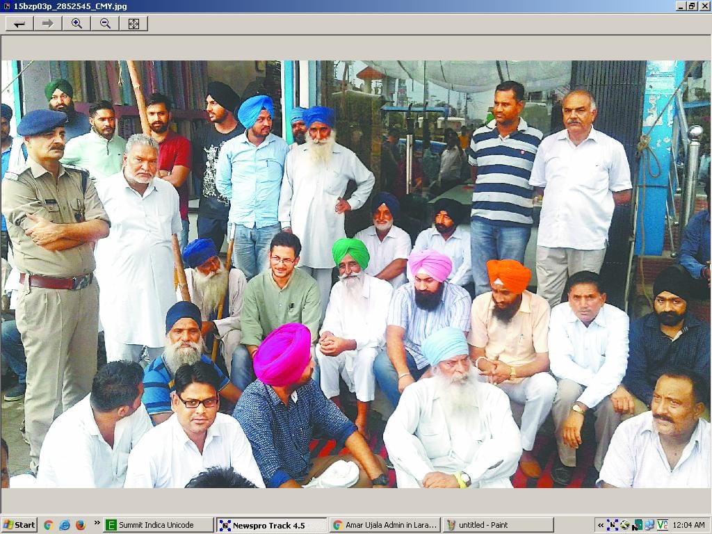 farmers brought vehicles along to protest for auction