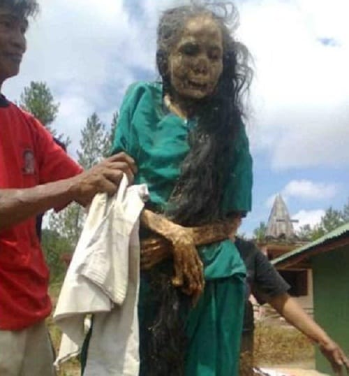 Dead women comes out from grave at Tana Toraja region of South Sulawesi in Indonesia