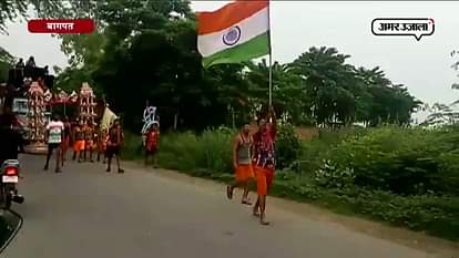 Kanwar yatri holding tiranga in hands in baghpat