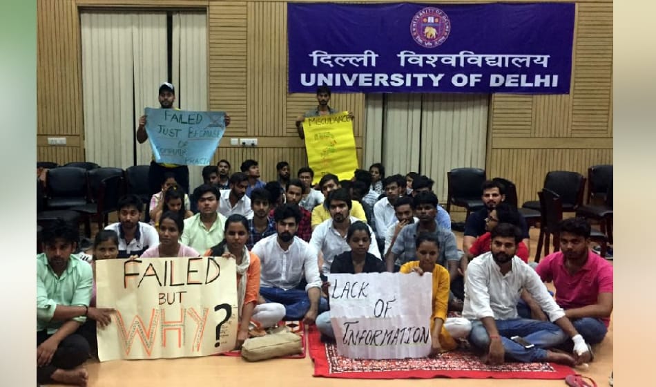 after scoring low marks in du college, students slap professor and climb dean terrace for suicide