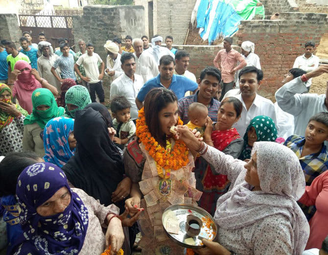 khali student wwe wrestler kavita dalal warm welcome at village