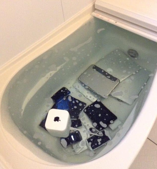 heartbroken girlfriend trashed partner collection of   Apple gadgets in the bath tub as a revenge