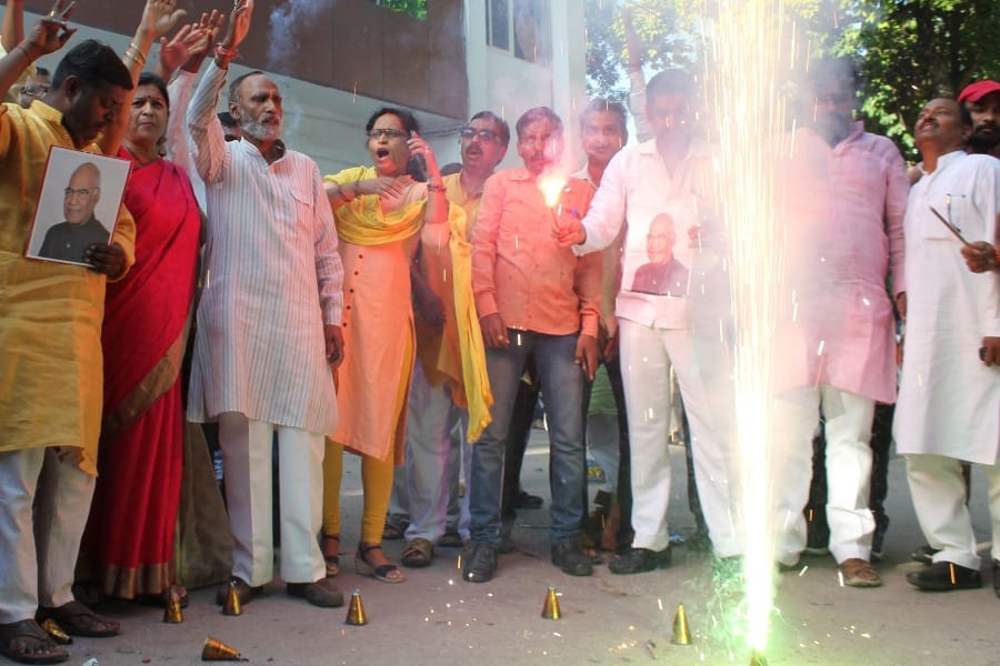 BJP activists celebrate Ramnath Kovind's victory in Lucknow in Uttar Pradesh.