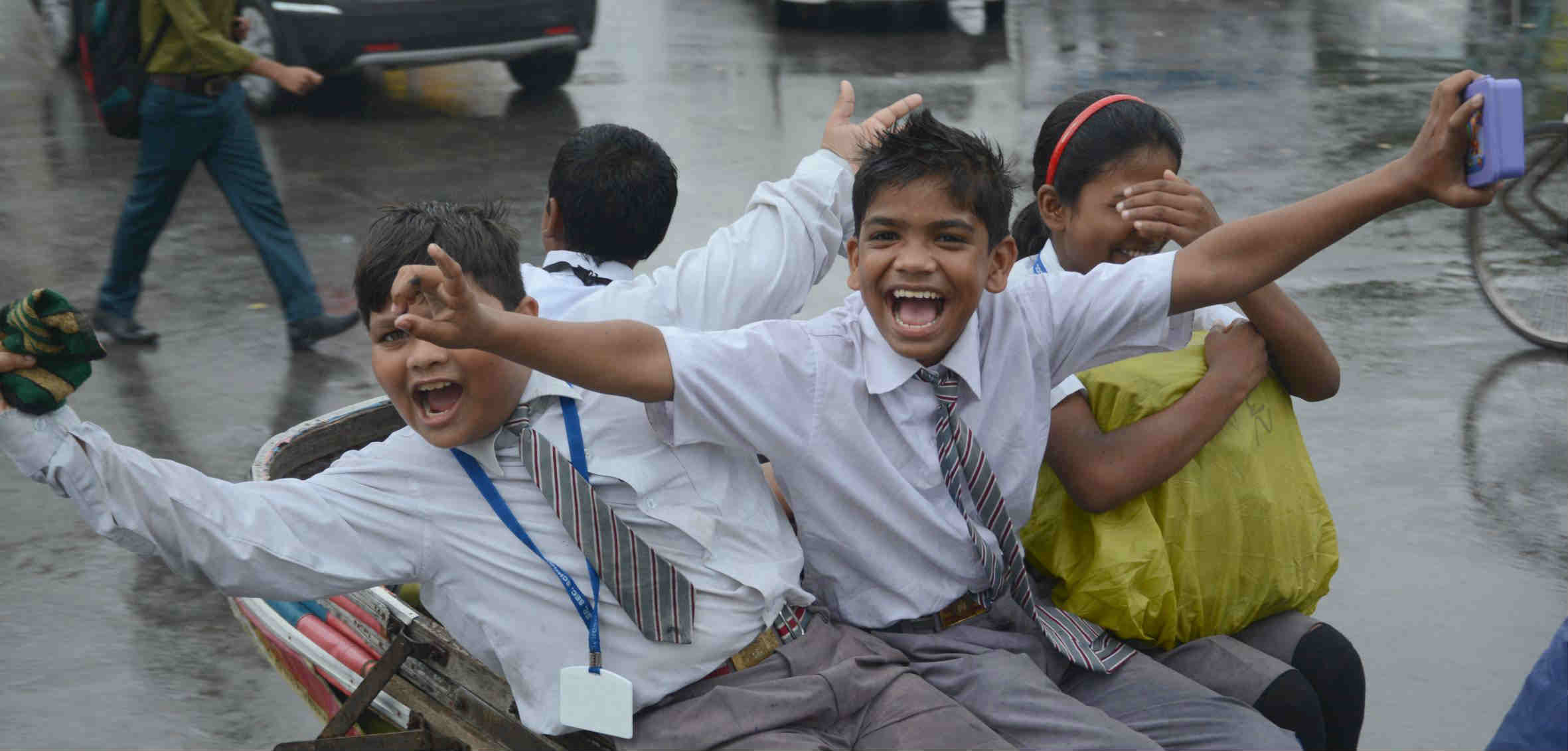 youngsters enjoying the rain