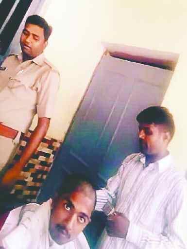 Youth's head shaved, police suspended