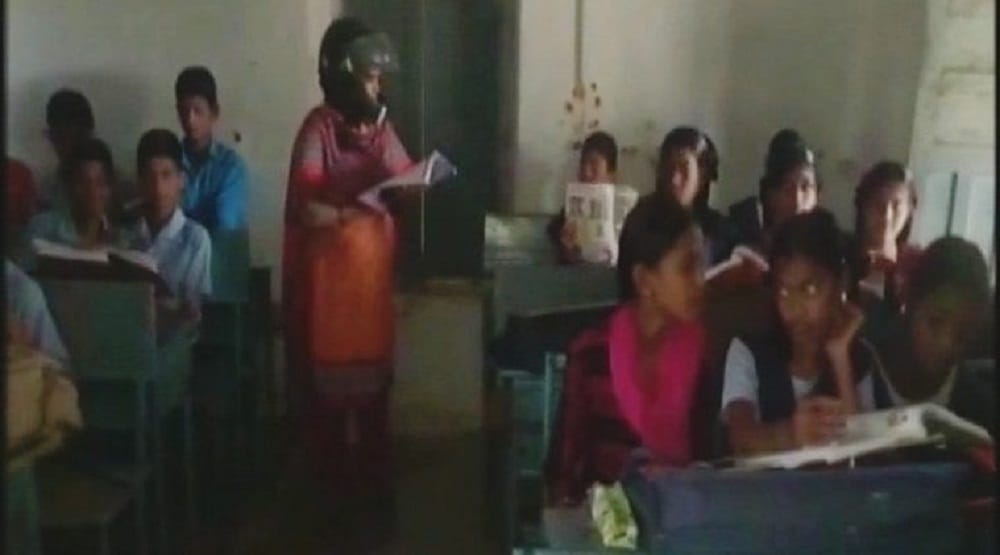 Telangana school teachers wearing helmet in   classrooms