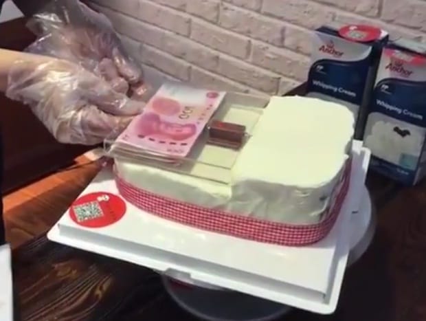 this cake dispenses money like ATM