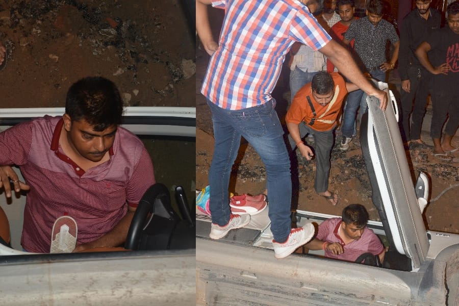 pics of a car falls down in a pit in lucknow 