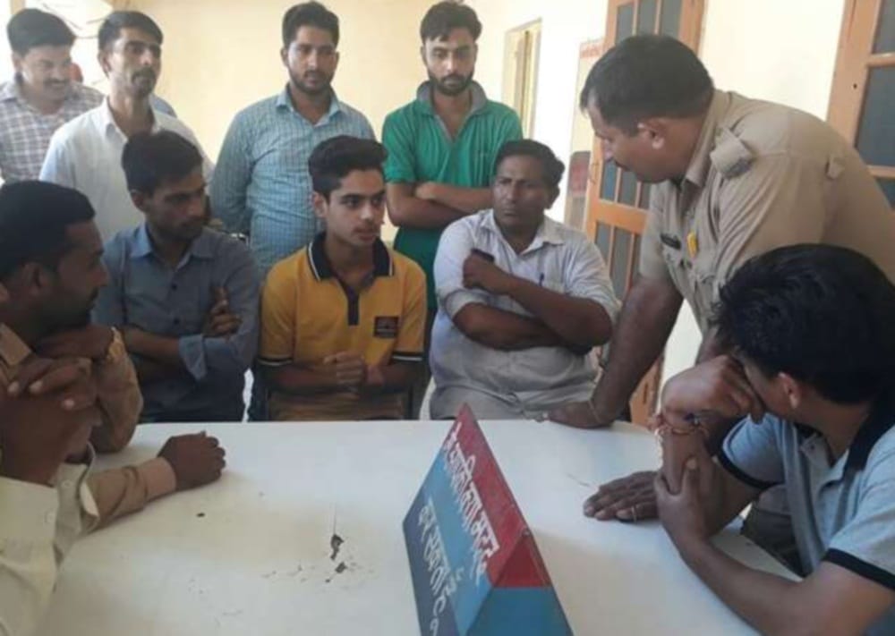 teacher cut beard of student