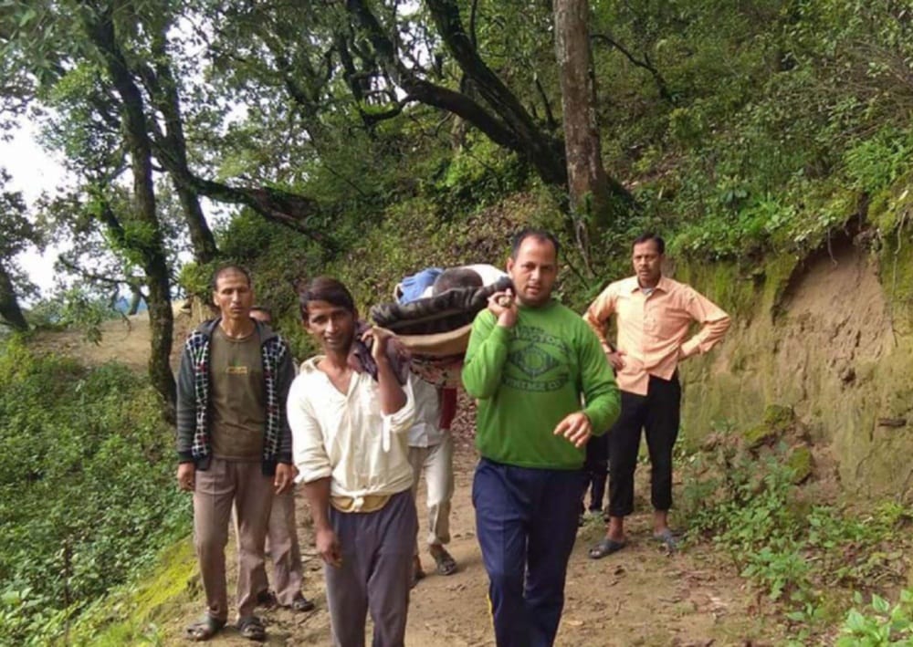 villagers rescue a old patient to hospital
