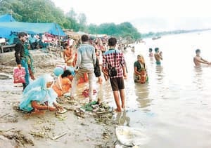 On the new moon, devotees dip the belief in the Ganges