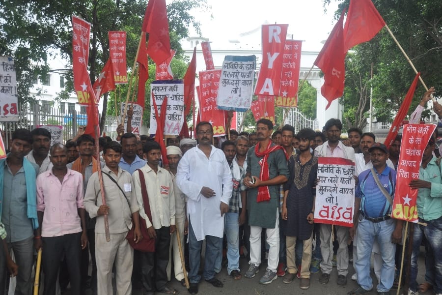  AISA members protest in front of Lucknow University.