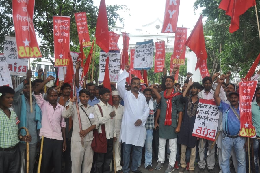  AISA members protest in front of Lucknow University.