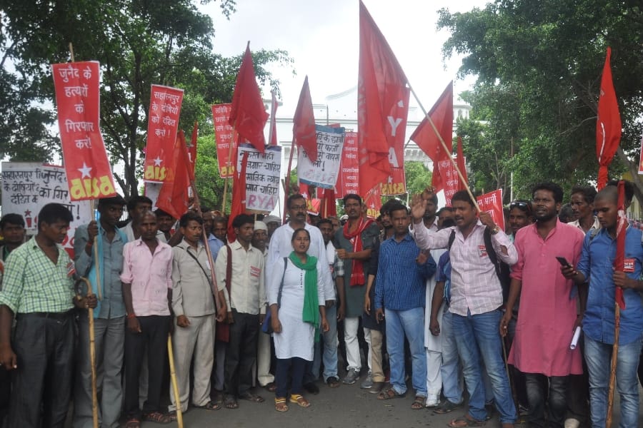  AISA members protest in front of Lucknow University.
