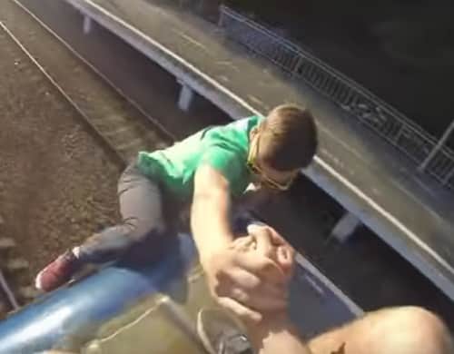 Watch viral video of 2 boys driving bycycle on   rooftop of moving train