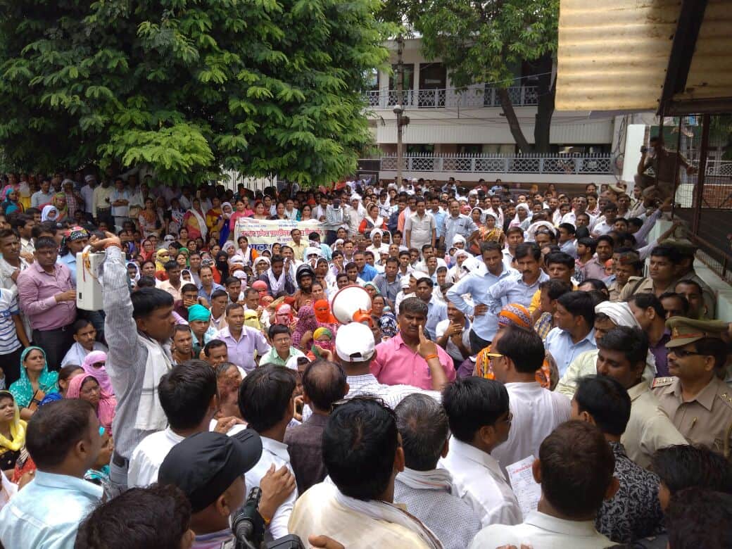 shikshamitra protesting outside office of hema malini in mathura