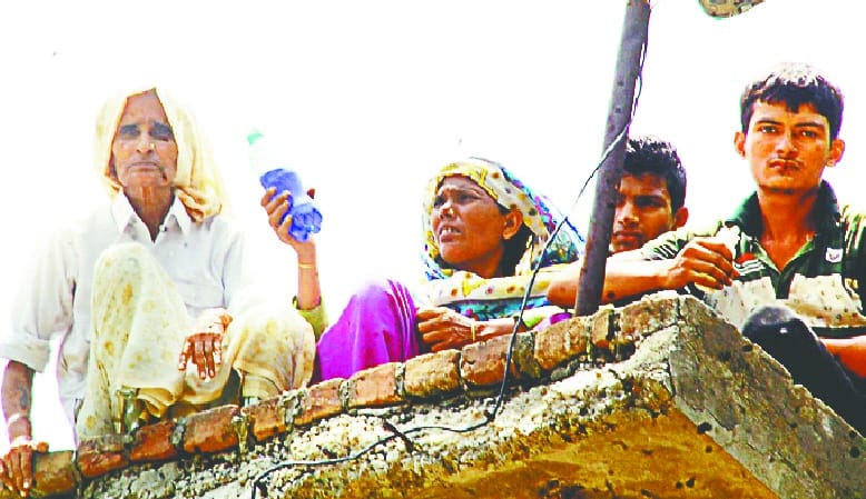 Women climbing on the roof with kerosene ken
