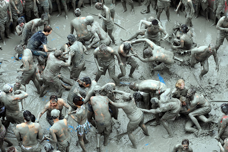 People play Holi in South Korea during the Boreyang Mud Festival see in pictures