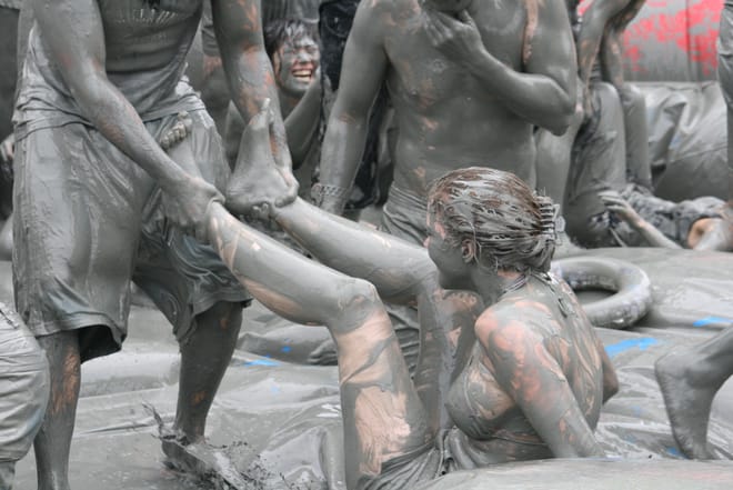 People play Holi in South Korea during the Boreyang Mud Festival see in pictures