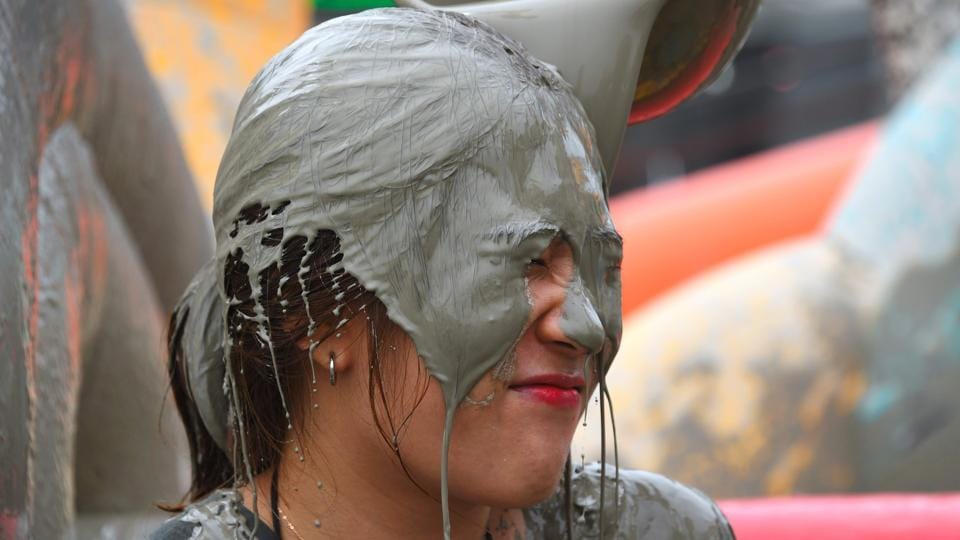 People play Holi in South Korea during the Boreyang Mud Festival see in pictures