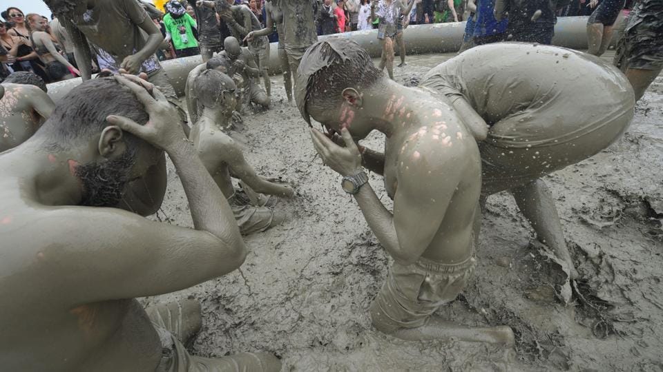 People play Holi in South Korea during the Boreyang Mud Festival see in pictures