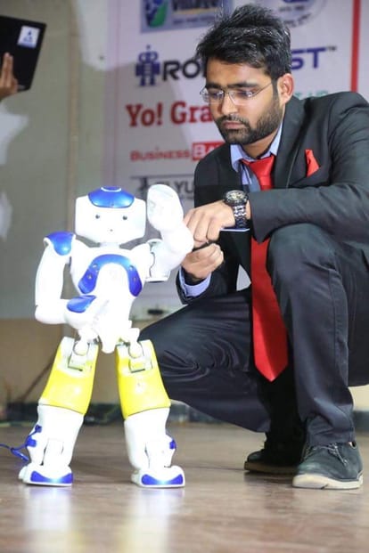 calculator man and robot expert meet with student