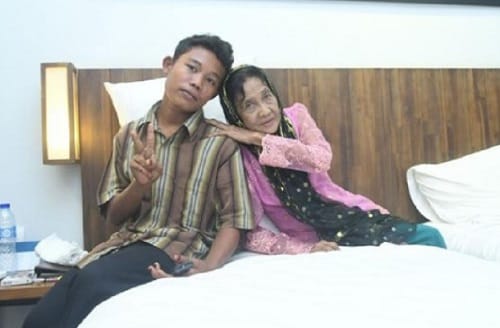 16 year old jealous husband Selamat locks  his 71 year old wife Rohaya in Indonesia