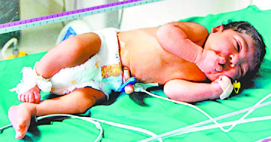new born girl found behind the house