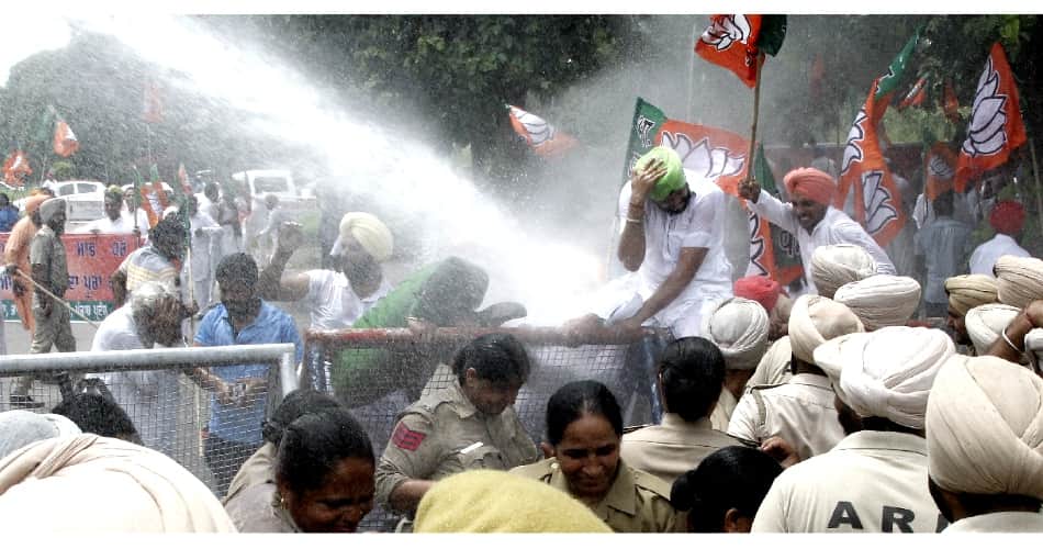 water cannon on protesters, chandigarh news